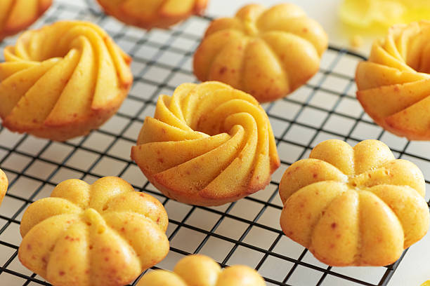 istock Autumn-Themed Mini pumpkin Cakes with Seasonal Decorations on White Background 2234355129
