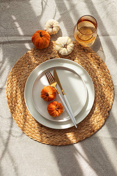 istock Autumn Table Setting with Decorative Pumpkins and Seasonal Leaves 2234355155