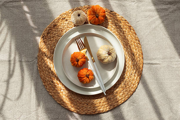 istock Autumn Table Setting with Decorative Pumpkins and Seasonal Leaves 2234355163