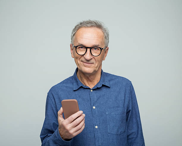 istock Portrait of content senior man using phone 2234361732