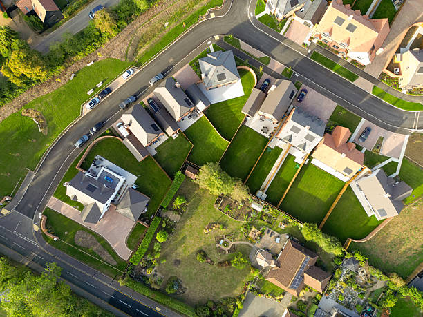 Drone top down view of newly purchased homes seen in a British housing development site. stock photo