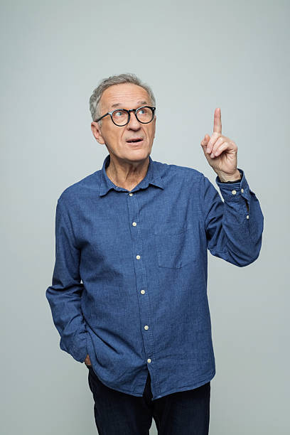 istock Portrait of senior man pointing at copy space 2234364089