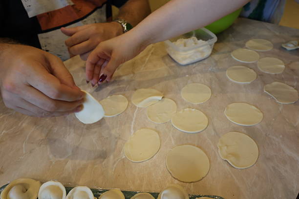istock Retro family kitchen: hand‑made dumplings and togetherness at the table 2234369159