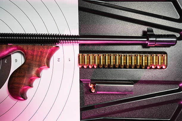 istock Historic automatic weapon and ammunition displayed on a target, ready for action, perfect for themed projects. 2234374293