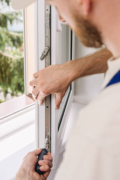 istock Repairman installs PVC window frame for improved energy efficiency 2234375484