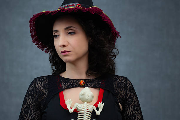 Ideal for Halloween, magic, spooky and fantasy themes. Horizontal studio portrait with copy space.