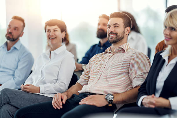 istock Engaging participants at a professional workshop in a bright conference room setting 2234381365