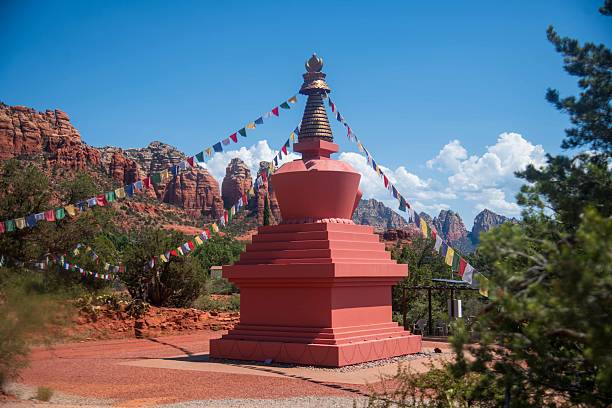 The Amitabha Stupa and Peace Park in Sedona featuring a 36-foot-tall Buddhist stupa with the red rock mountains in the background