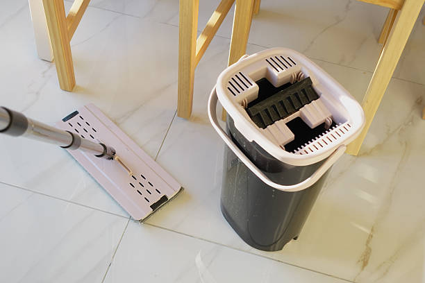 istock Mop and bucket ready for cleaning the tiled floor 2234383528