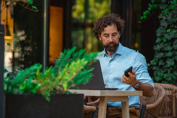 istock Mature Professional Freelancer Working Remotely in Coffee Shop 2234383872