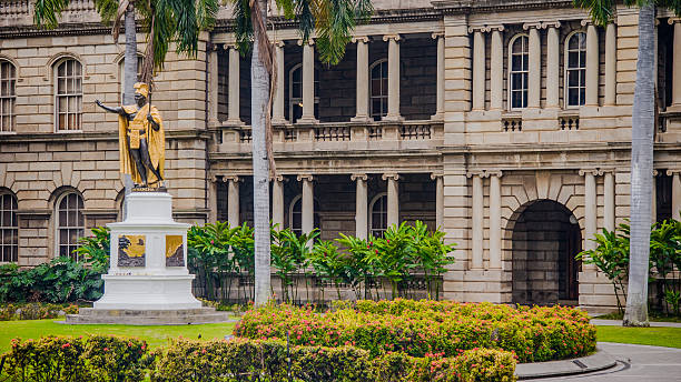 Honolulu, Hawaii, March 1, 2006:  The iconic statue of King Kamehameha stands proudly before the historic Ali'iolani Hale in Honolulu, symbolizing Hawaii's strength and heritage.