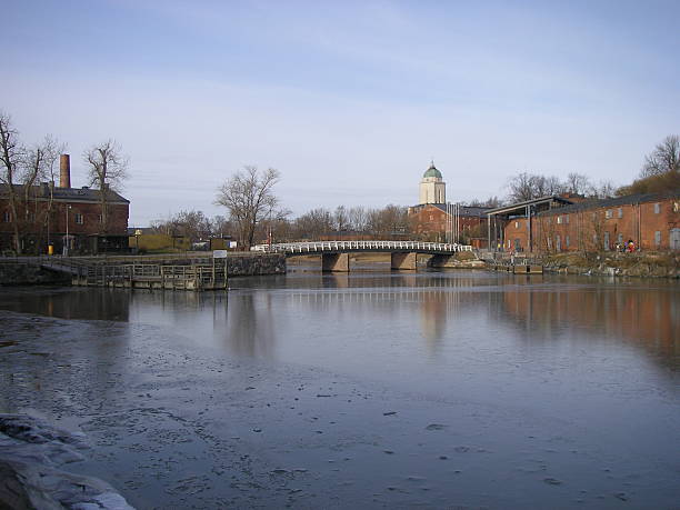 istock Winter Scene: Frozen Canal, Historic Buildings, and Bridge. 2234390060