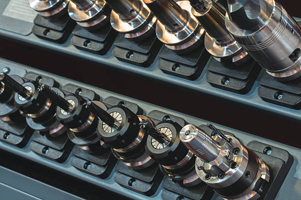 istock Metalworking tools are neatly organized on a display rack, featuring various sizes of drill bits and milling tools, highlighting the craftsmanship and technology in machining. 2234393143