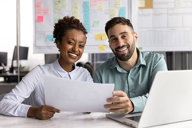 istock Client and manager reviewing business documents during negotiations 2234397535