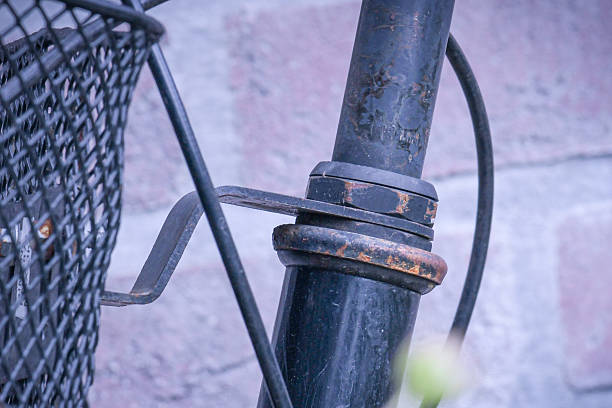 istock Close-up view of old, rusty bicycle components displaying a vintage look against a textured background 2234399065