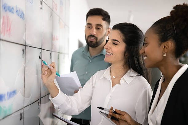istock Three multiracial colleagues brainstorm ideas in office 2234399205