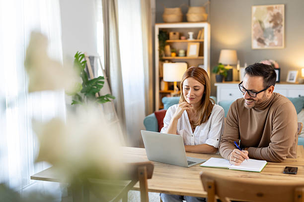 istock Couple enjoying collaborative work session in cozy living space. 2234399905