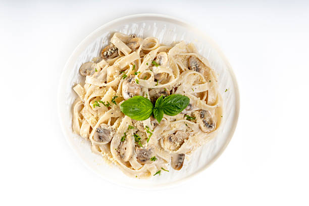 istock Pasta carbonara cream sauce with mushroom in a white plate 2234406433