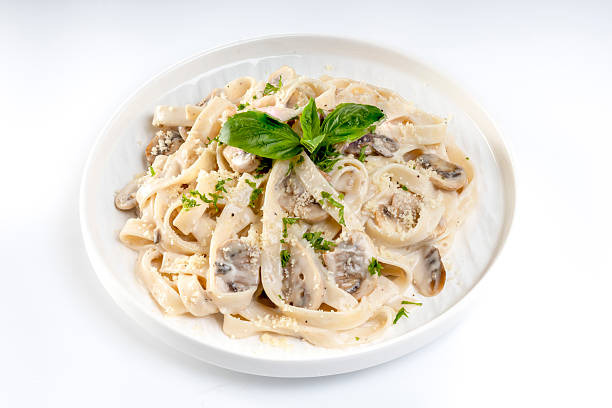 istock Pasta carbonara cream sauce with mushroom in a white plate 2234406435