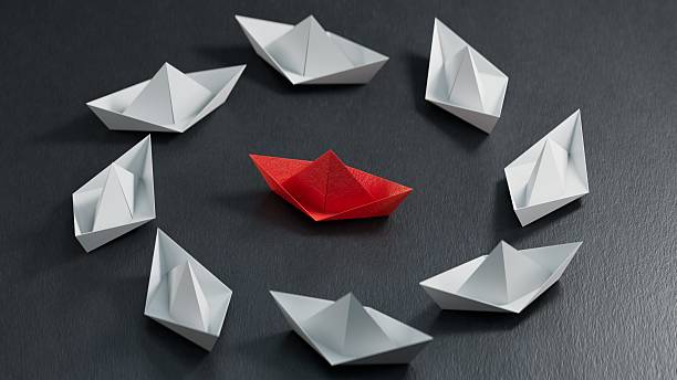 istock Different business concept.new ideas. paper art style. creative idea.3d illustration paper ship and leadership concept.3D rendering on black background. 2234406940