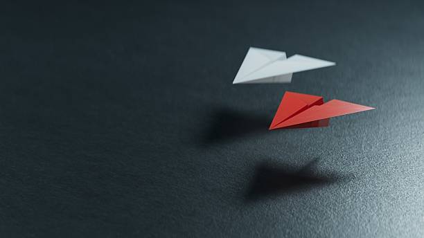 istock Different business concept.new ideas. paper art style. creative idea.Red and white paper plane. Leaderplane concept.3D rendering on black background. 2234406943
