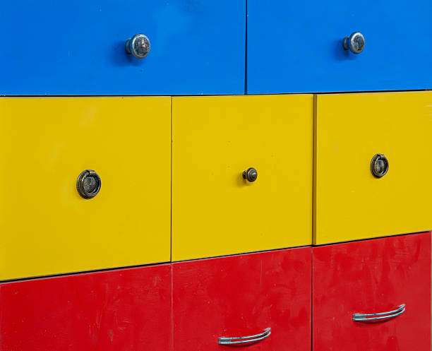 A rejected cabinet was repurposed for storage due to cost-efficiency and availability - this decision reduces waste and supports operational continuity despite manufacturing flaws. selective focus