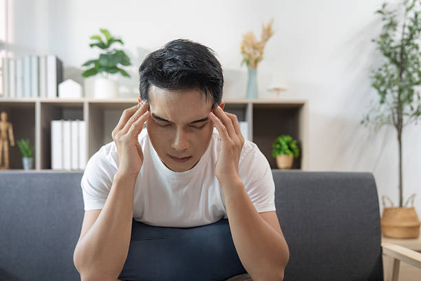 istock Emotional struggle. Young man dealing with stress and anxiety at home. 2234408733