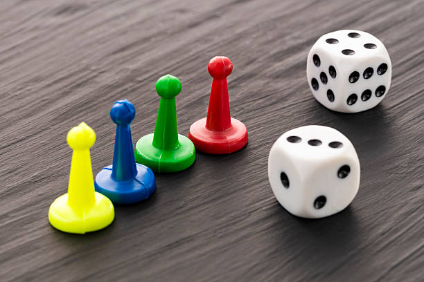istock Board game pieces and dice - Dark background 2234408778