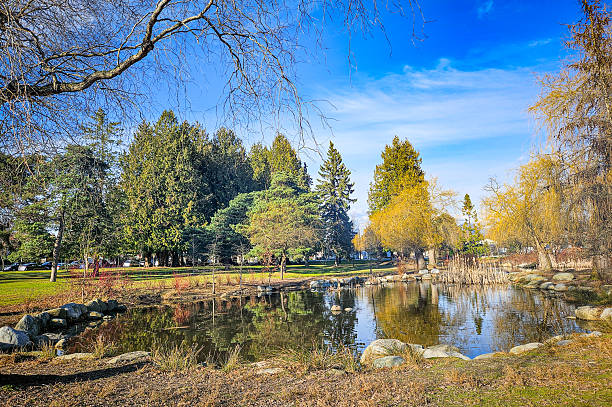 istock Beautiful green park with a pond 2234413067