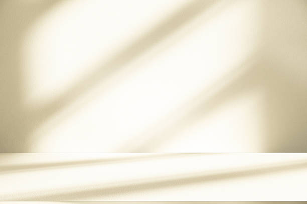 istock Studio style background wall decoration presentation uses white and beige tones. with shadows cast from a nearby window, concept creating a decorative 2234421565