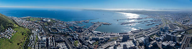 Table Bay, Cape Town’s Foreshore, Waterfront precinct, Cape Town Stadium, the port and Signal Hill in an ultra wide aerial panoramic.