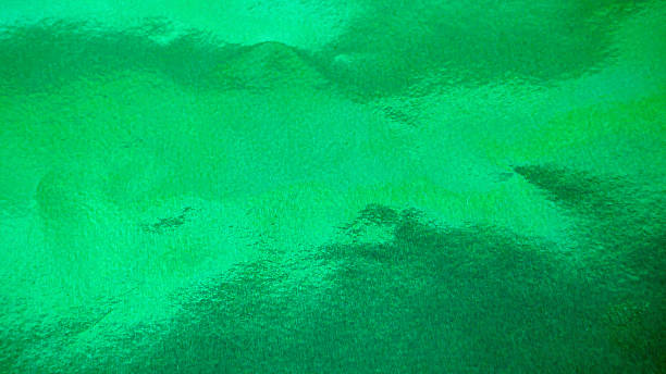 istock Vibrant green foil paper texture, abstract shiny background 2234424044