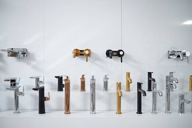 istock Modern Bathroom Faucets Displayed on Wall in Contemporary Showroom Setting 2234425150