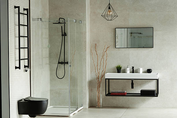 istock Modern Minimalist Bathroom Interior Featuring Glass Shower and Contemporary Sink 2234425270