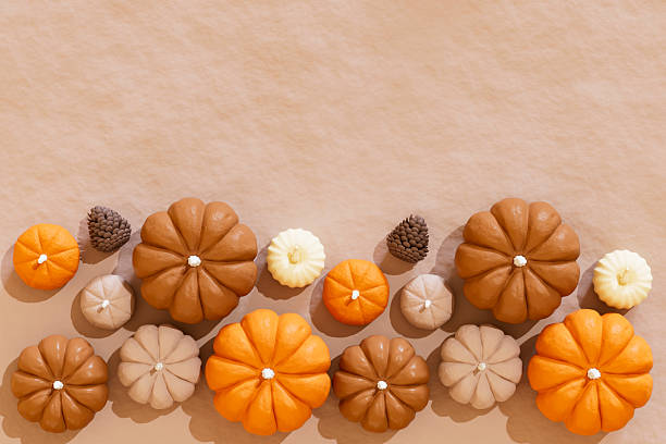 A digitally generated image featuring several pumpkins arranged on a surface of crumpled brown paper. The textured paper adds a rustic and organic feel, enhancing the warm and cozy atmosphere of autumn. This seasonal composition evokes themes of harvest, fall decor, and Thanksgiving, making it ideal for seasonal promotions, invitations, or editorial content.
