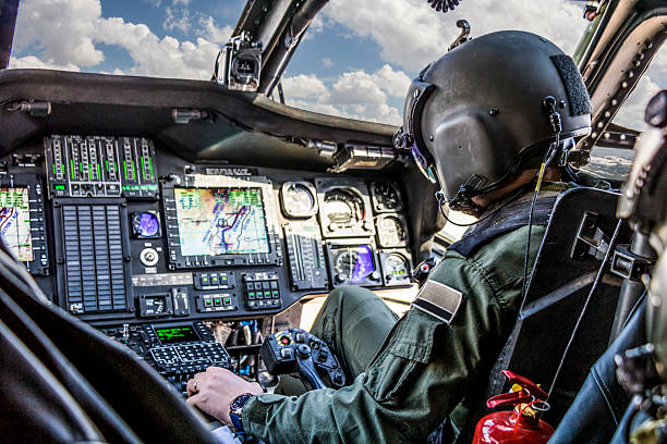 istock Army pilot flying military helicopter 2234428977