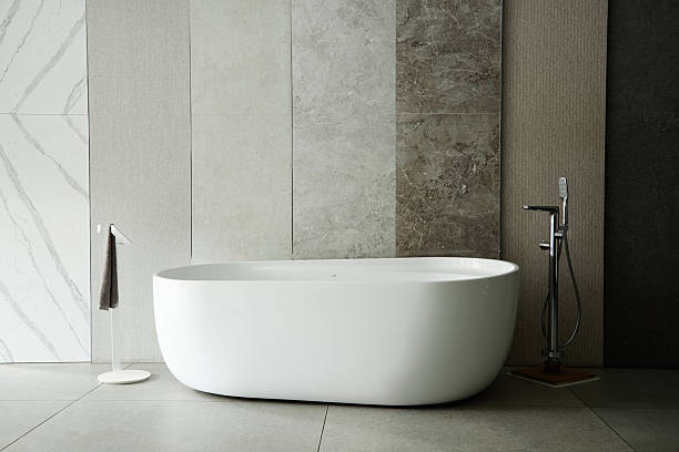 istock Modern Freestanding Bathtub Standing in Minimalist Luxury Bathroom Interior 2234429708
