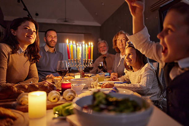 istock Happy extended family having dinner on Hanukkah. 2234431065