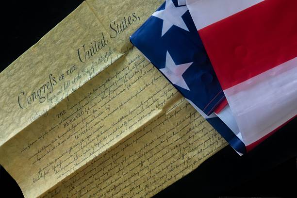 istock U.S. Constitution and American Flag Close-Up 2234431825
