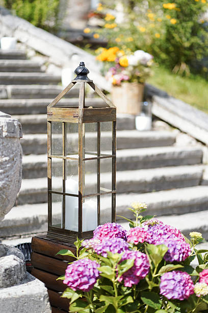 istock Rustic lantern with candle beside blooming hydrangea flowers on stone steps outdoors 2234436593