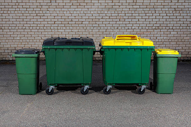istock Green Recycling Bins with Yellow and Black Lids 2234436716