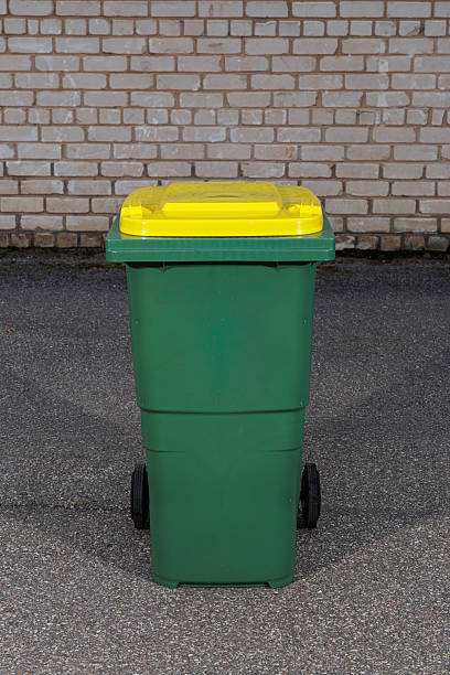 istock Green Recycling Bin with Yellow Lid for Waste Collection 2234436726