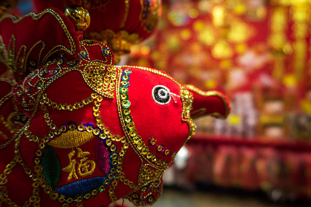 Close-up of hanging ornamental props for year of the Pig or Boar zodiac hanging decoration in Singapore retail shop during Chinese New Year festive season