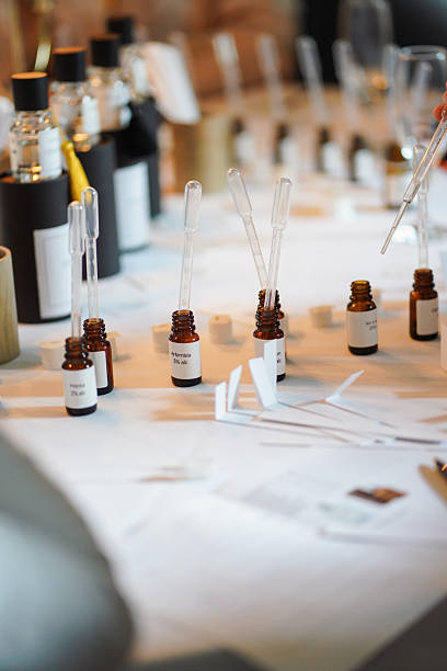 Perfumery workshop table with droppers and amber bottles of essential oils