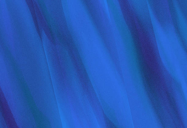 Abstract blue glowing shape on soft grainy textured artistic backdrop poster background