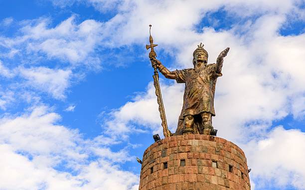Cusco, Peru – July 05, 2020: A achacutec Monument against a blue sky with clouds in Pachacutec Oval, Cusco, Peru.