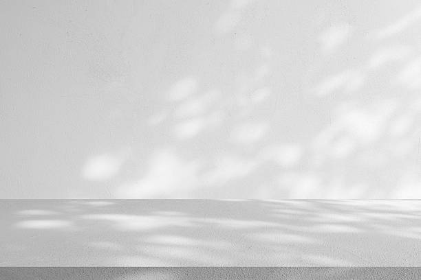 istock white plain wall background texture with shadow of window from sunlight and perspective cement table shelf for ads and advertisement product such as cosmetic or content or goods design display concept 2234448860