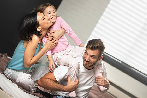 istock Young family having fun in   bed 2234449005