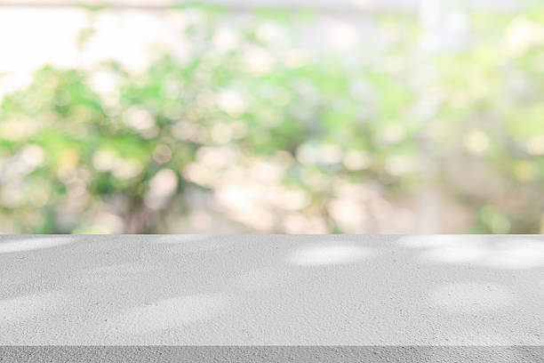istock blur inside interior on modern room and garden view form window with sunlight and  perspective wood tabletop shelf for show or advertise or promote product and content on display and web design element concept 2234450833