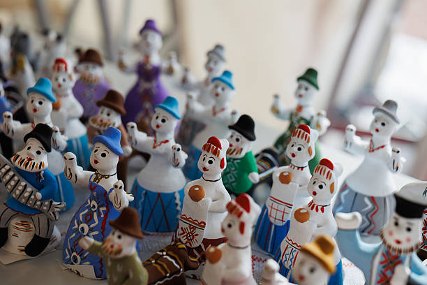 A delightful collection of colorful handcrafted snowman figurines, each with unique charm